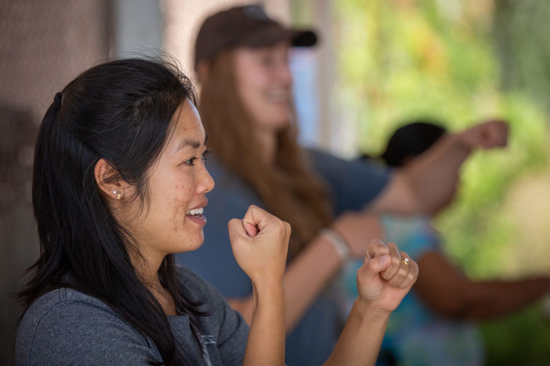 Missionary leads an exercise class through a short-term mission program