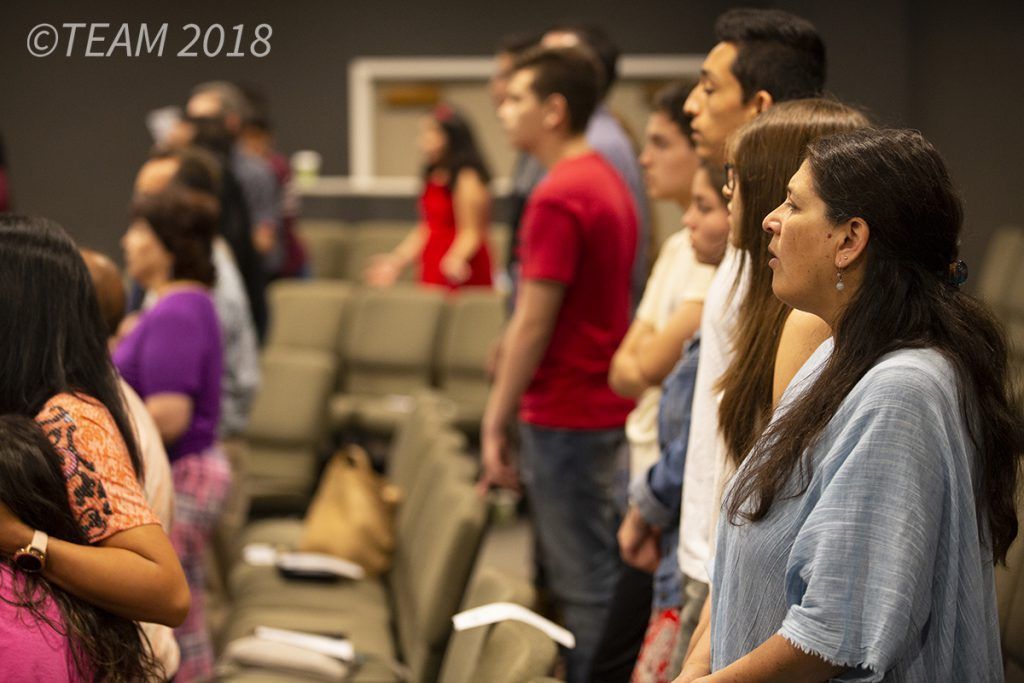 Members from the Impacto church plant worship together in North Carolina.