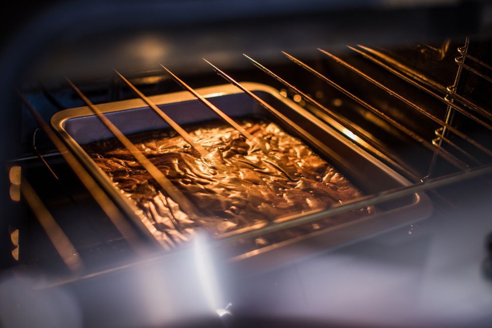 brownies baking and rising due to sugar levels