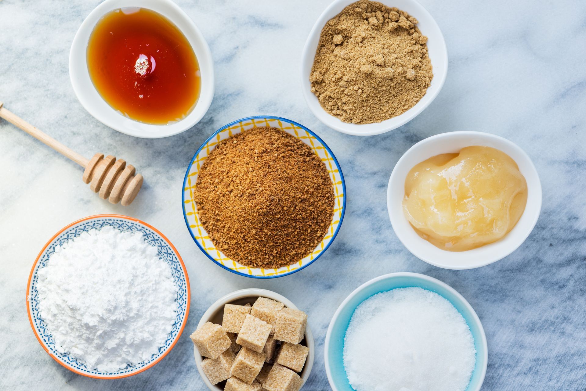 different types of sugars for baking including honey, powdered, granulated, demerara, etc.