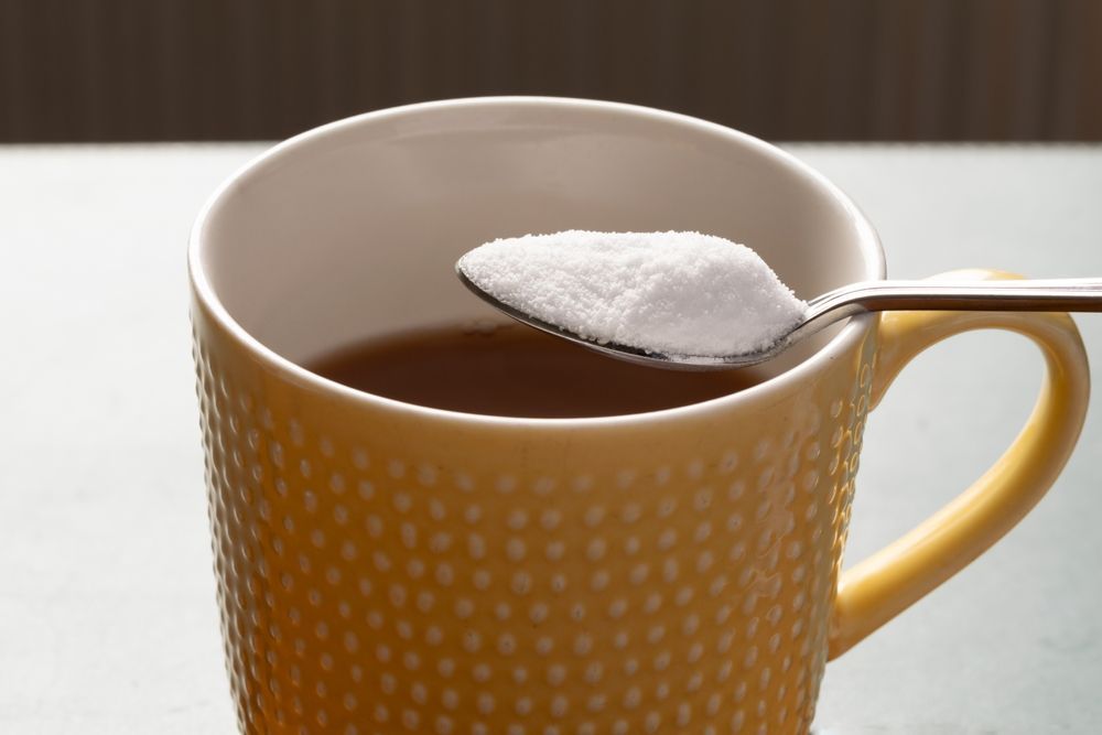 A cup of coffee with a spoon in it