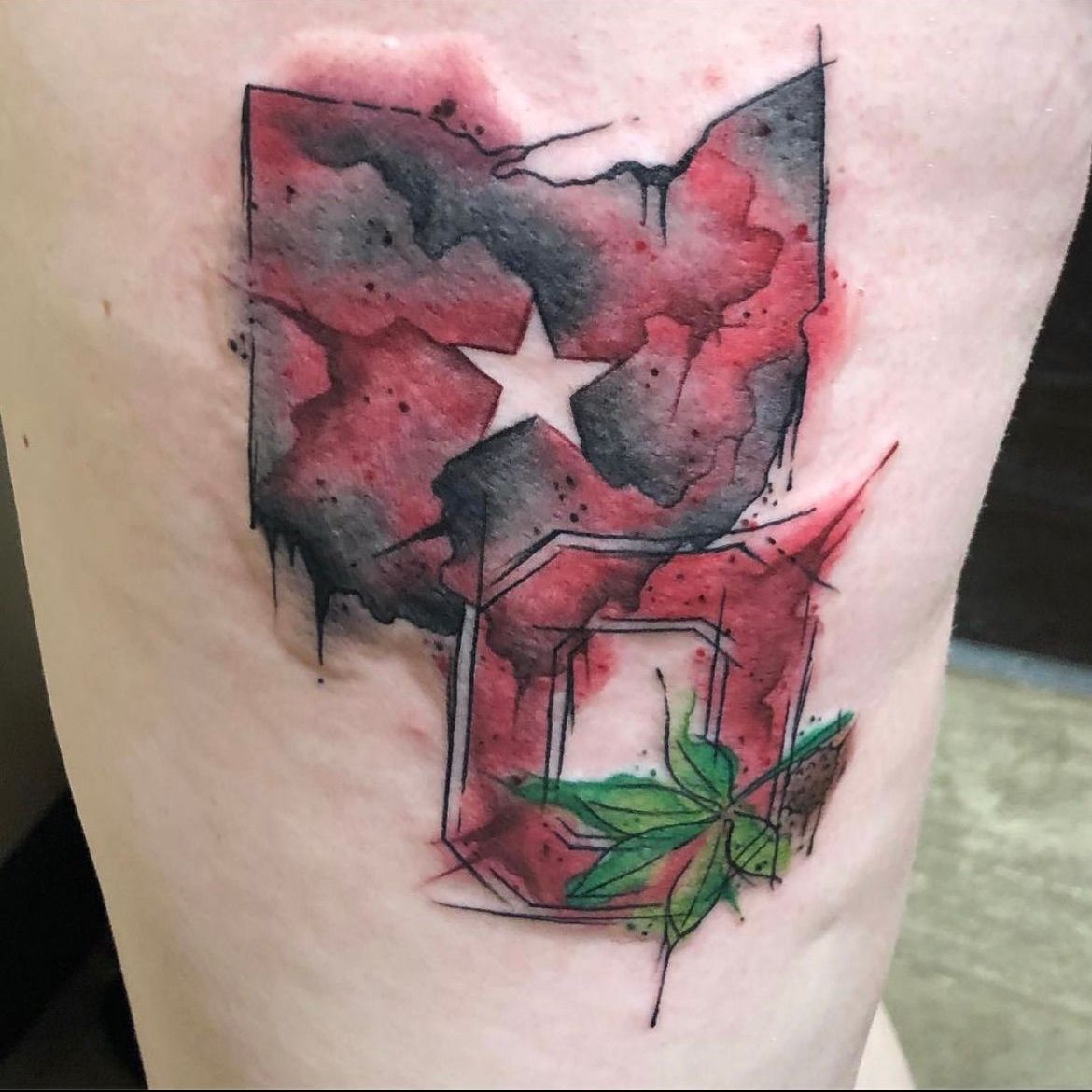 A person has a tattoo of the state of ohio