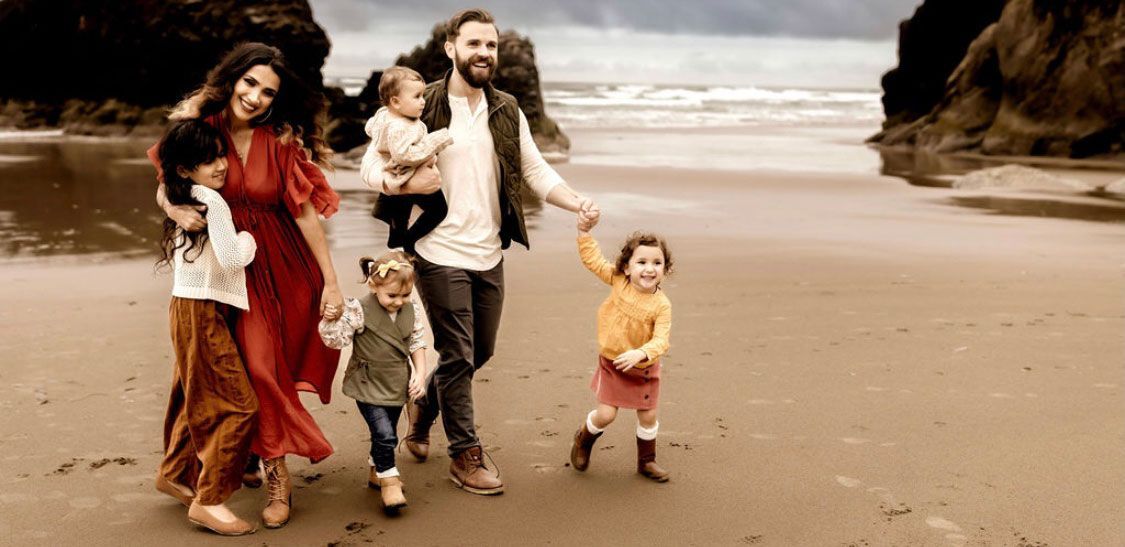 Dr. Nic West and his family at the beach