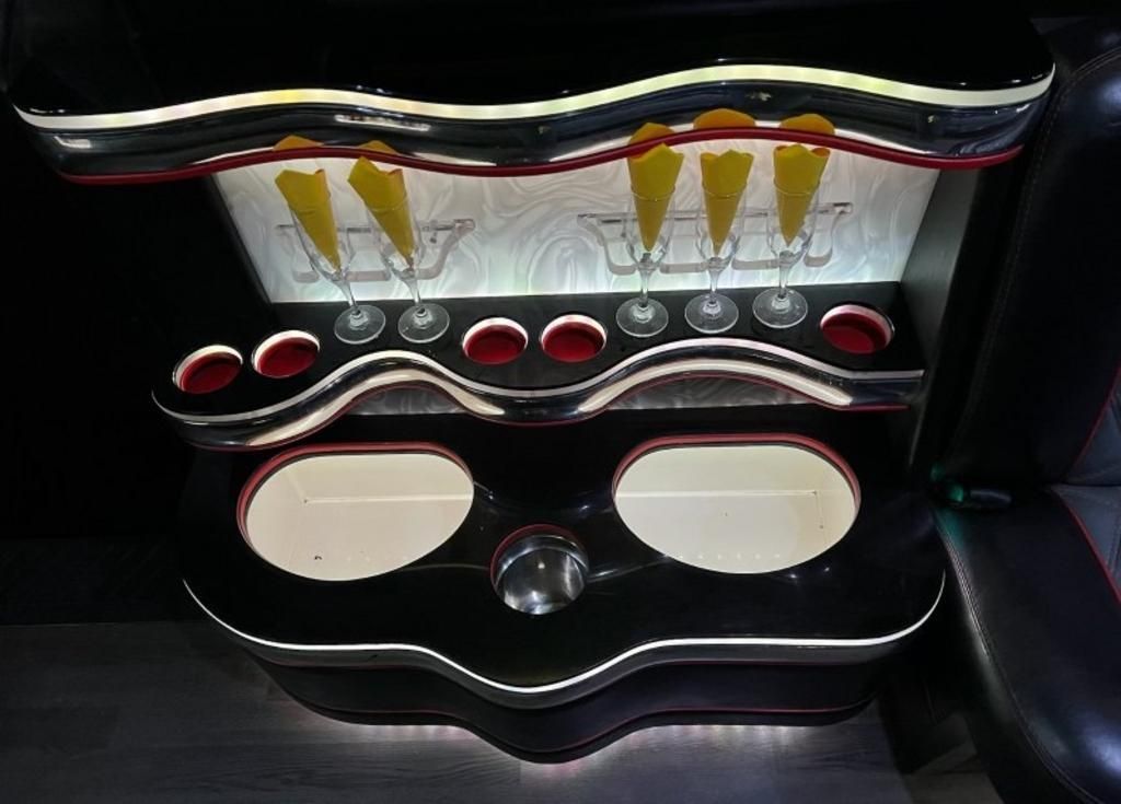 A black table with a lot of glasses on it