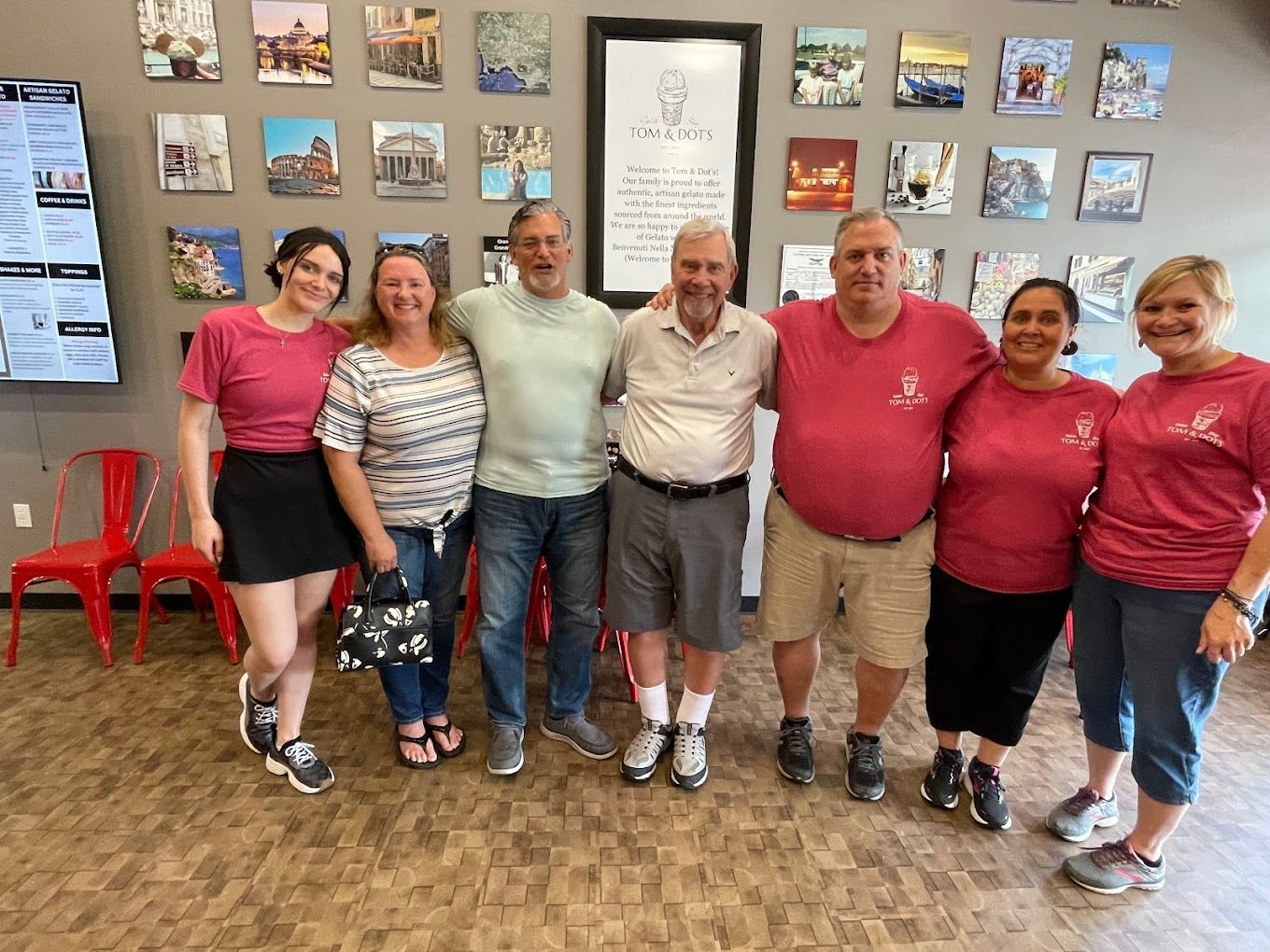A group of people are posing for a picture in a room.