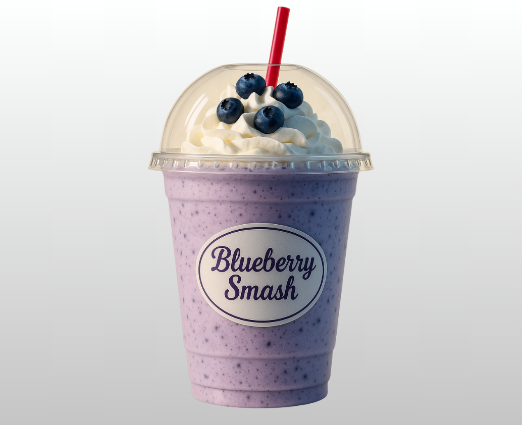 A blueberry smash milkshake with whipped cream and blueberries on top