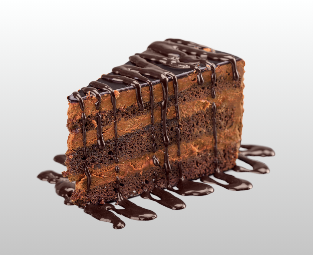 A slice of chocolate cake with chocolate sauce on it