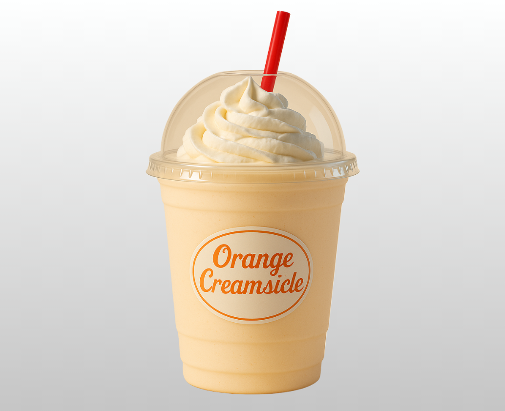 An orange creamsicle milkshake with whipped cream