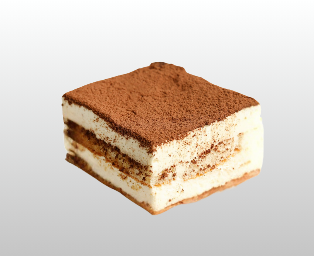 A piece of tiramisu cake with cocoa powder on top