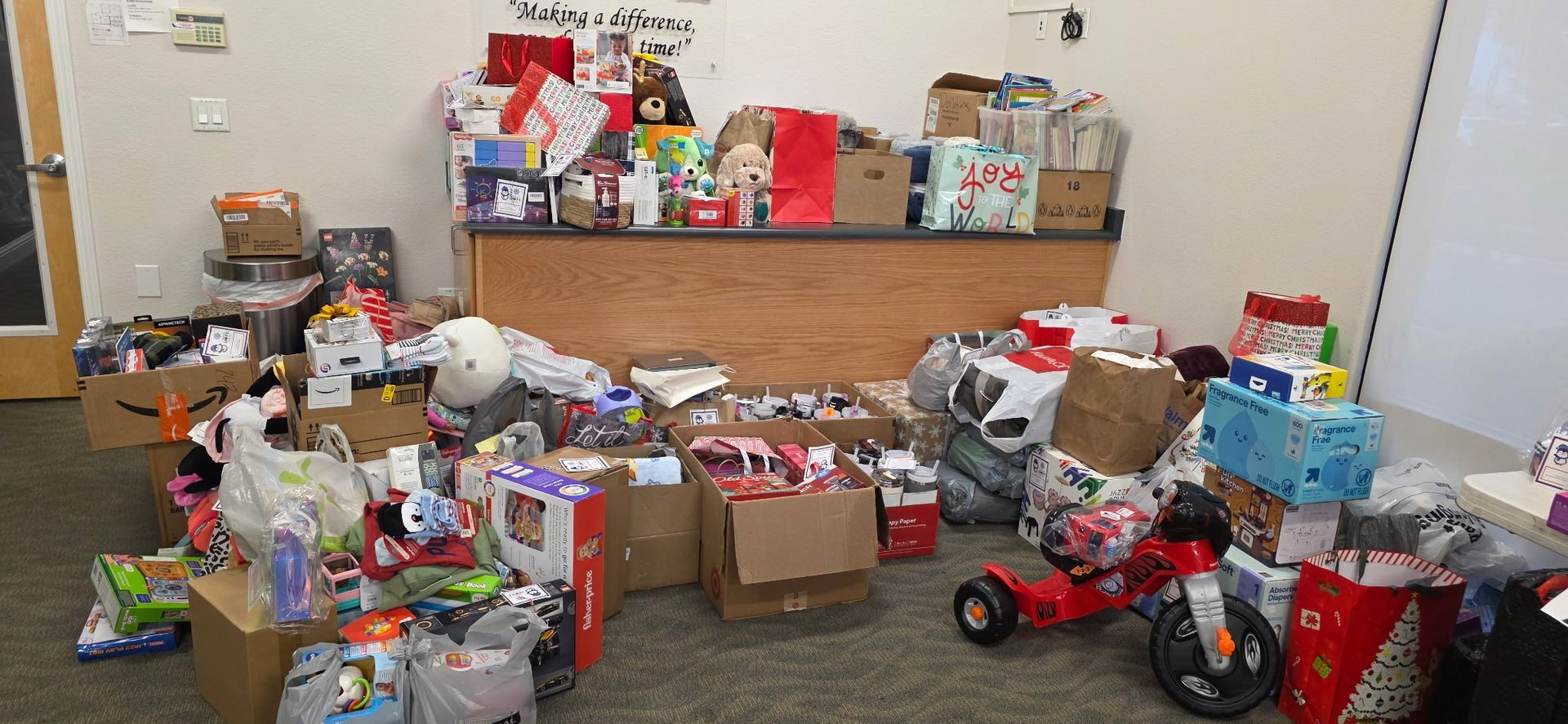 A room filled with Christmas gifts for foster youth