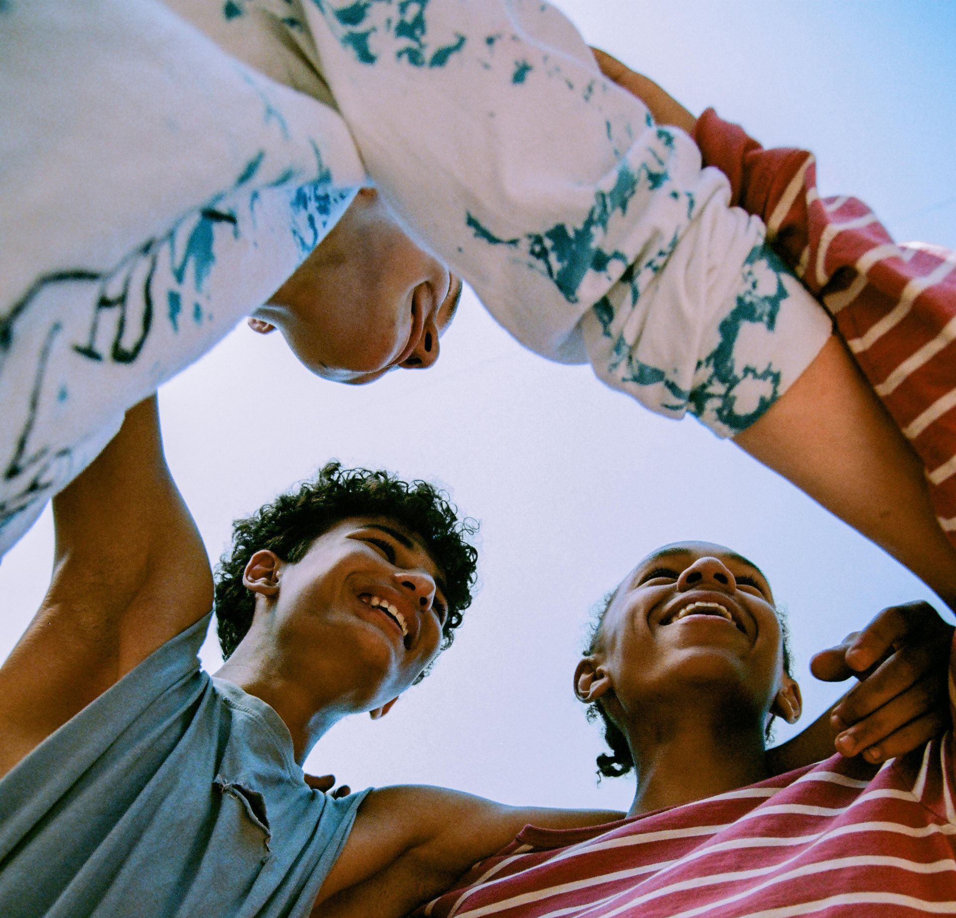 A group of people are looking up at the sky