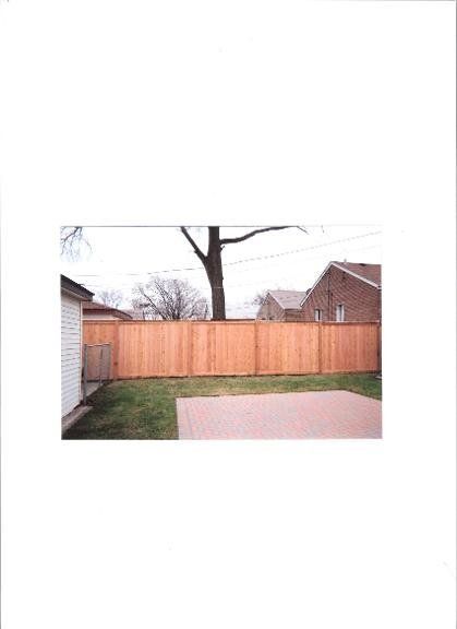 Wooden Fence and Old Tree — Maywood, IL — Anaya and Sons Fence Company