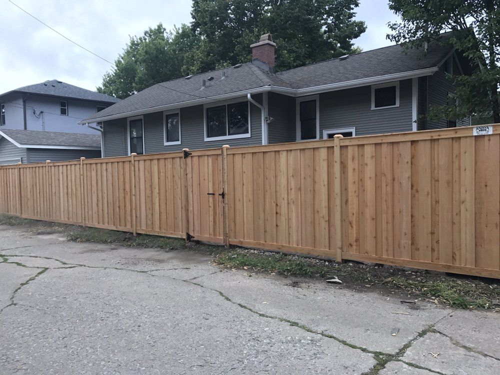 Gray House with Fence — Maywood, IL — Anaya and Sons Fence Company