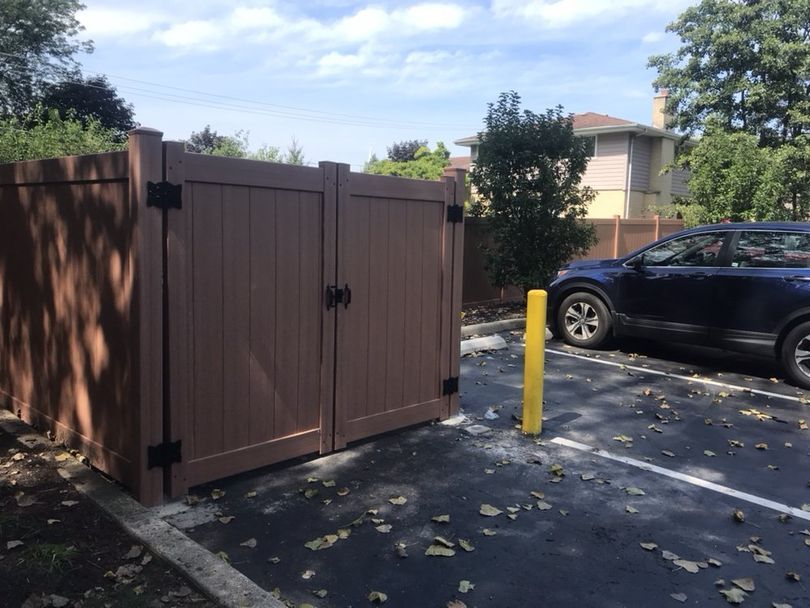 Backyard Fence with Car Outside — Maywood, IL — Anaya and Sons Fence Company