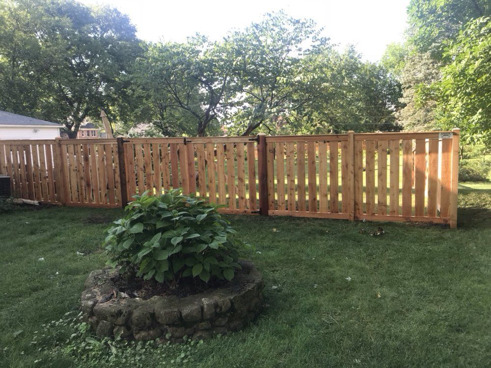 Wooden Fence at the Grass — Maywood, IL — Anaya and Sons Fence Company