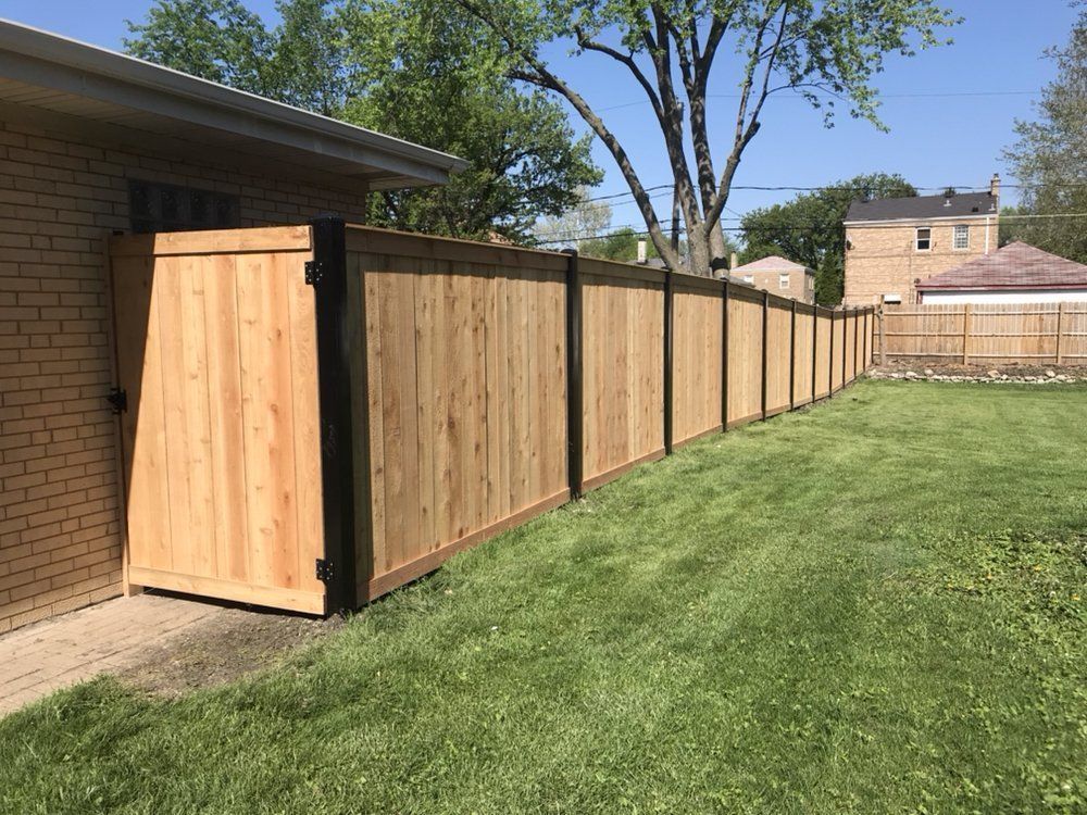 Wooden Commercial Fence with Brown Paint — Maywood, IL — Anaya and Sons Fence Company