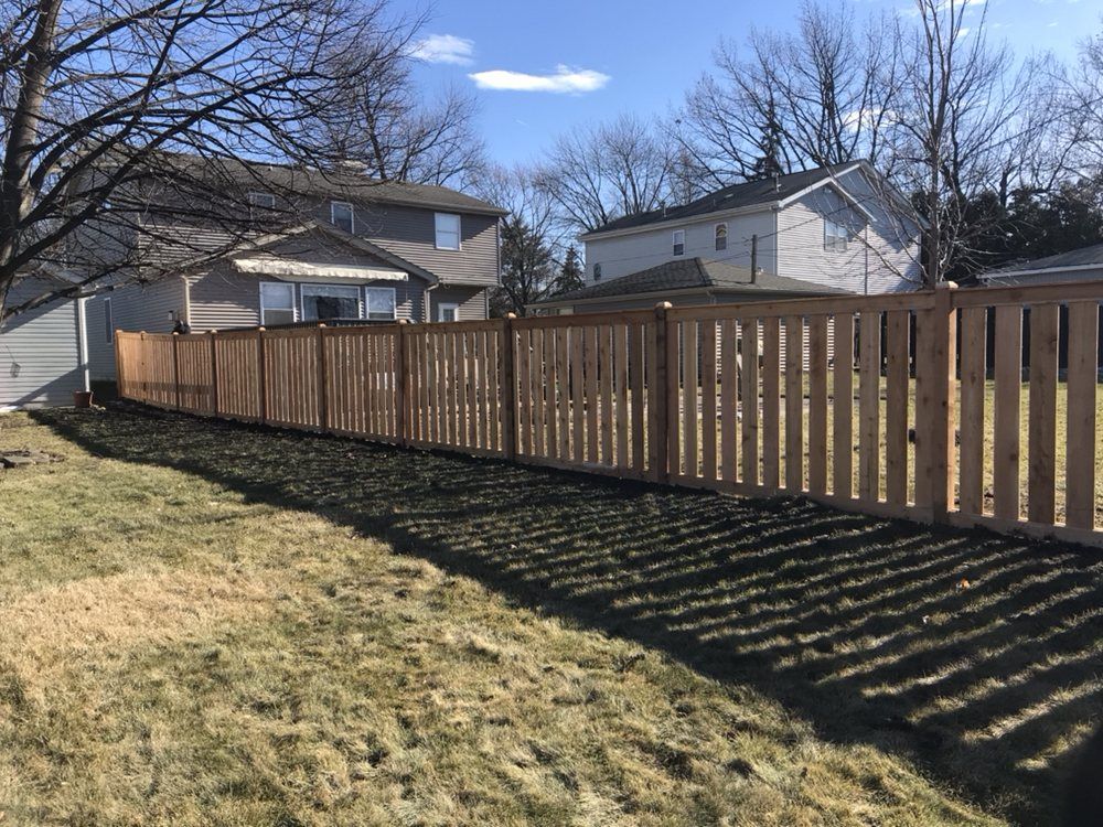 Long Fence with Shadow — Maywood, IL — Anaya and Sons Fence Company