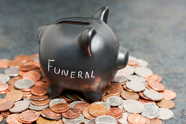  A piggy bank with a black ribbon, symbolizing a funeral savings account