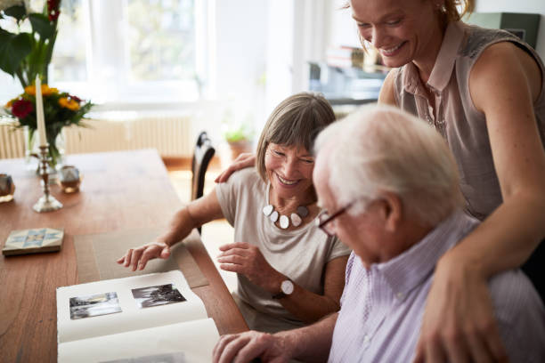 Happy elders enjoying photo album