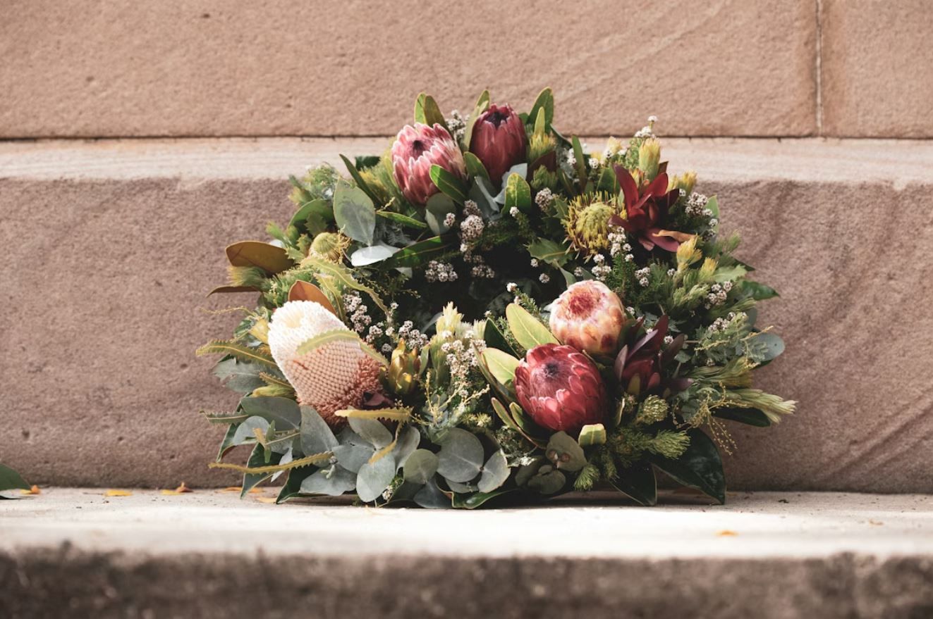 funeral flower arrangement on stone steps in Rio Bravo, TX