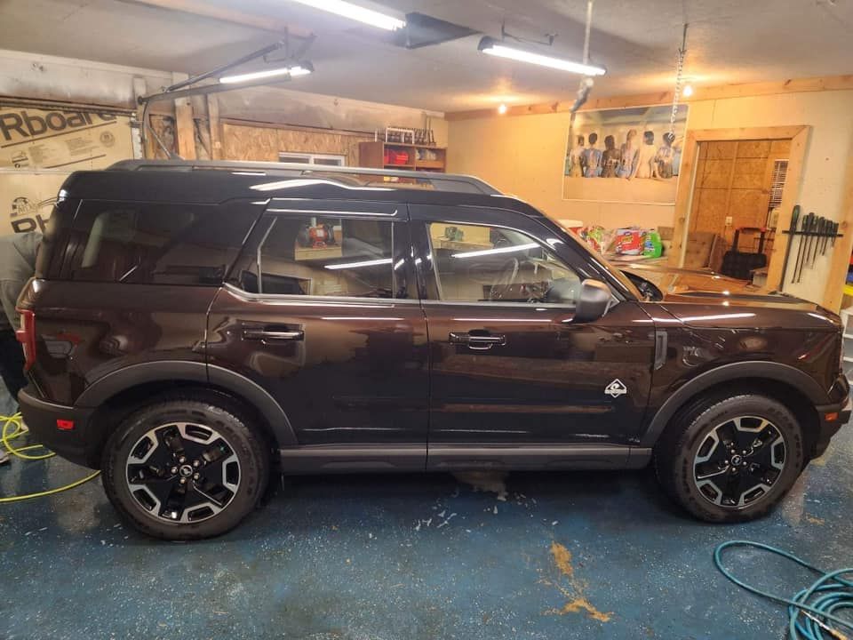 Brown Ford Bronco Sport parked inside a garage.