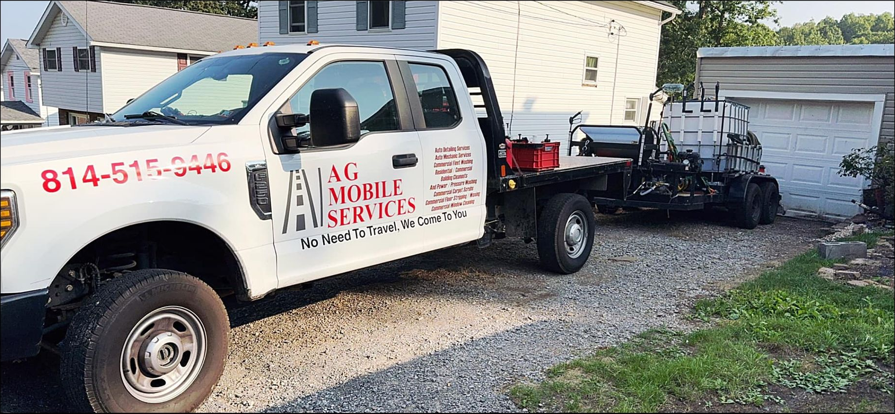 White pickup truck with the phone number 814-515-3440 and the logo 