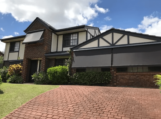 black folding arm awnings installed on brisbane home