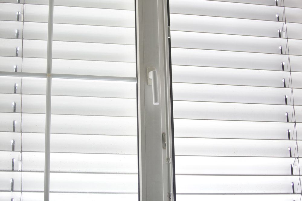 Detail View of Closed Window Blinds — We Install Security Screens in Brisbane South, QLD