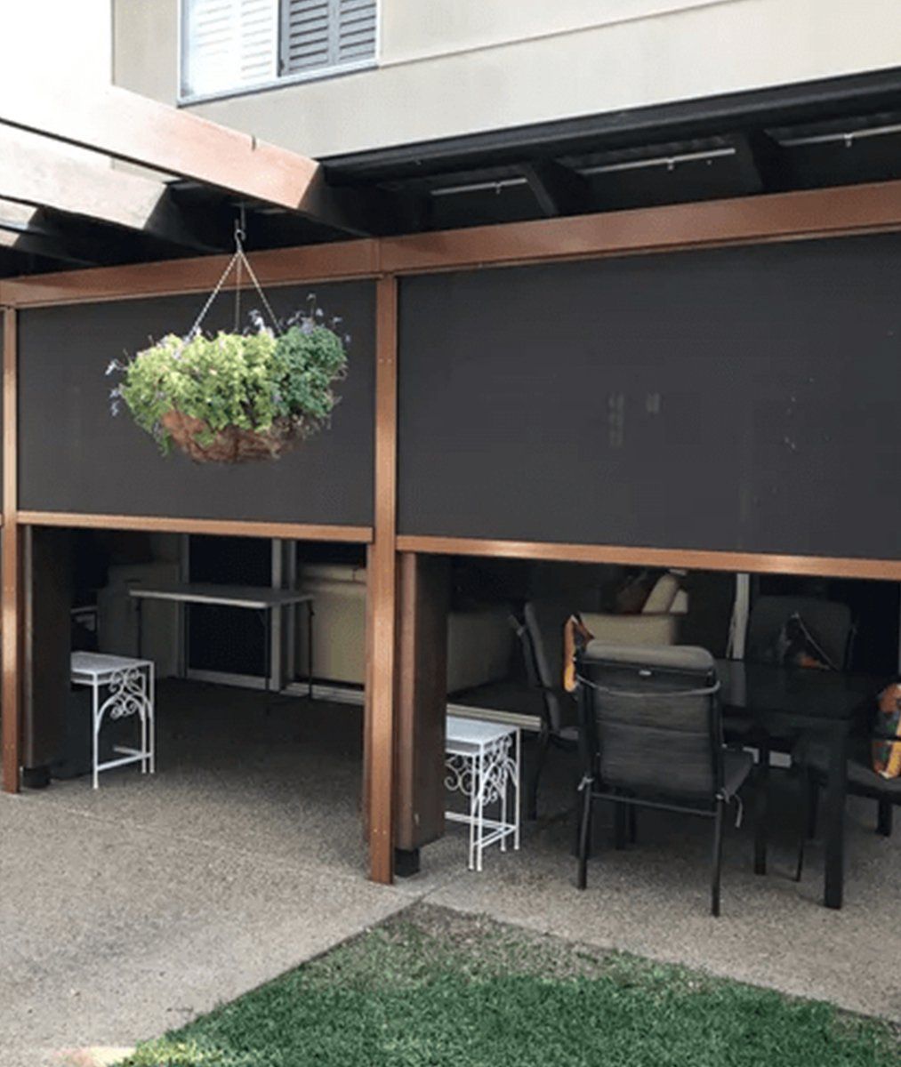 black Ziptrack awnings with brass aluminium framing in brisbane backyard