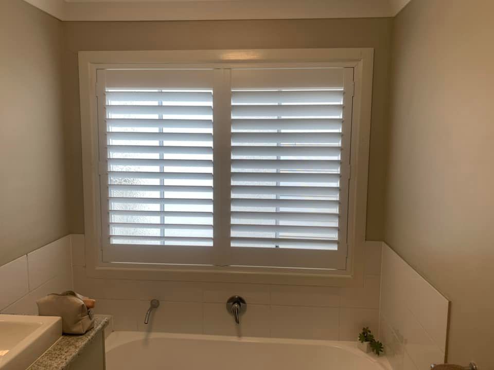 white pvc bathroom plantation shutters