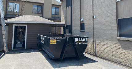 10 yard dumpster inside an apartment complex for roofing debris