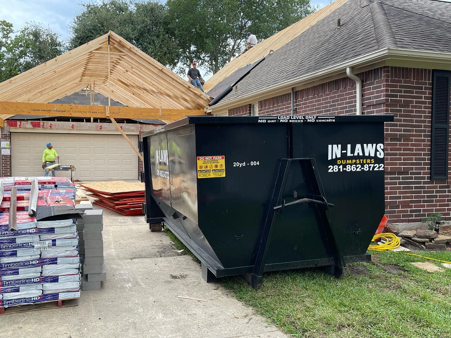 A photo of a roofing dumpster rental project.