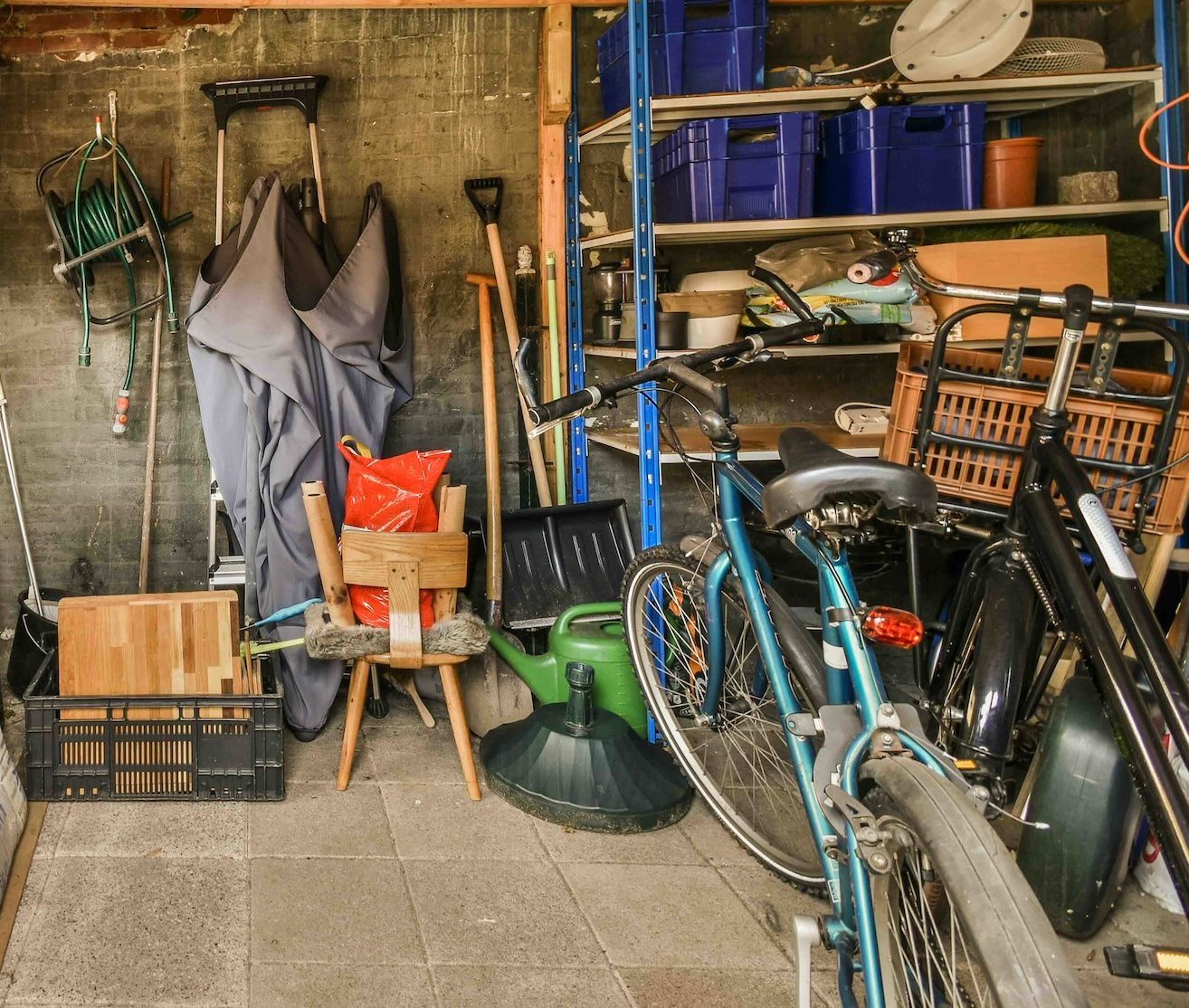 Photo of a messy garage that needs a clean out.