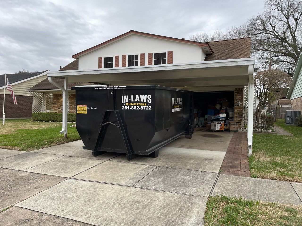 20 yard dumpster under carport in Pasadena, Texas