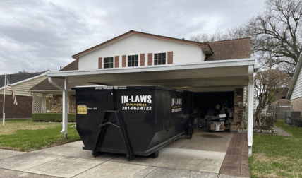 20 yard dumpster under a carport in Pasadena, TX