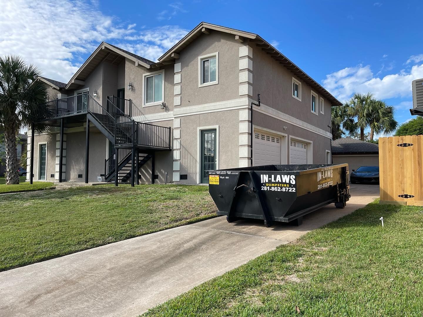 10 yard dumpster in driveway of house in Nassau Bay, Texas