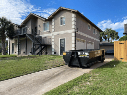 10 yard dumpster in a driveway in Nassau Bay, TX