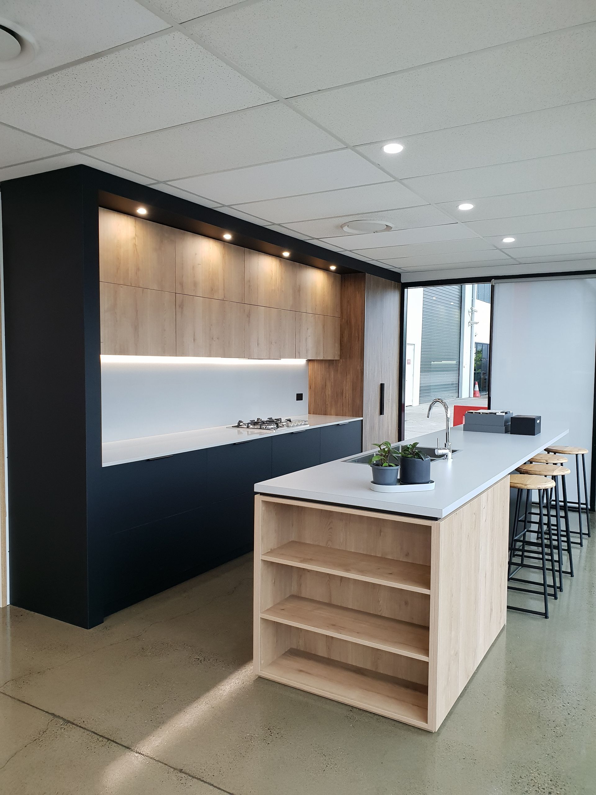 A kitchen with a large island in the middle of it