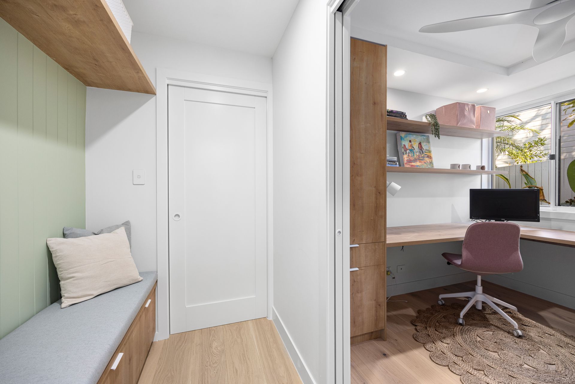 A Walk in Closet Filled with Lots of Clothes and Shoes — Tailored Interiors in Wacol, QLD