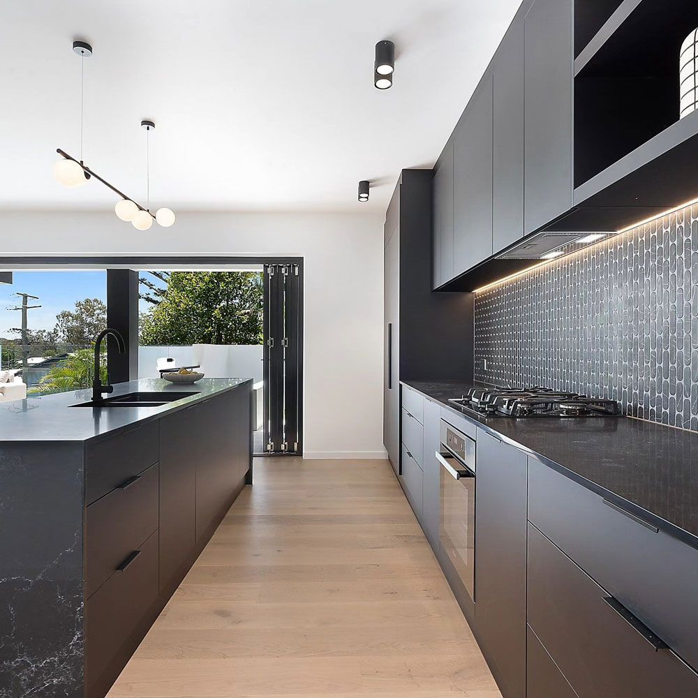 A Close up Of a Wooden Cabinet with Black Handles — Tailored Interiors in Wacol, QLD