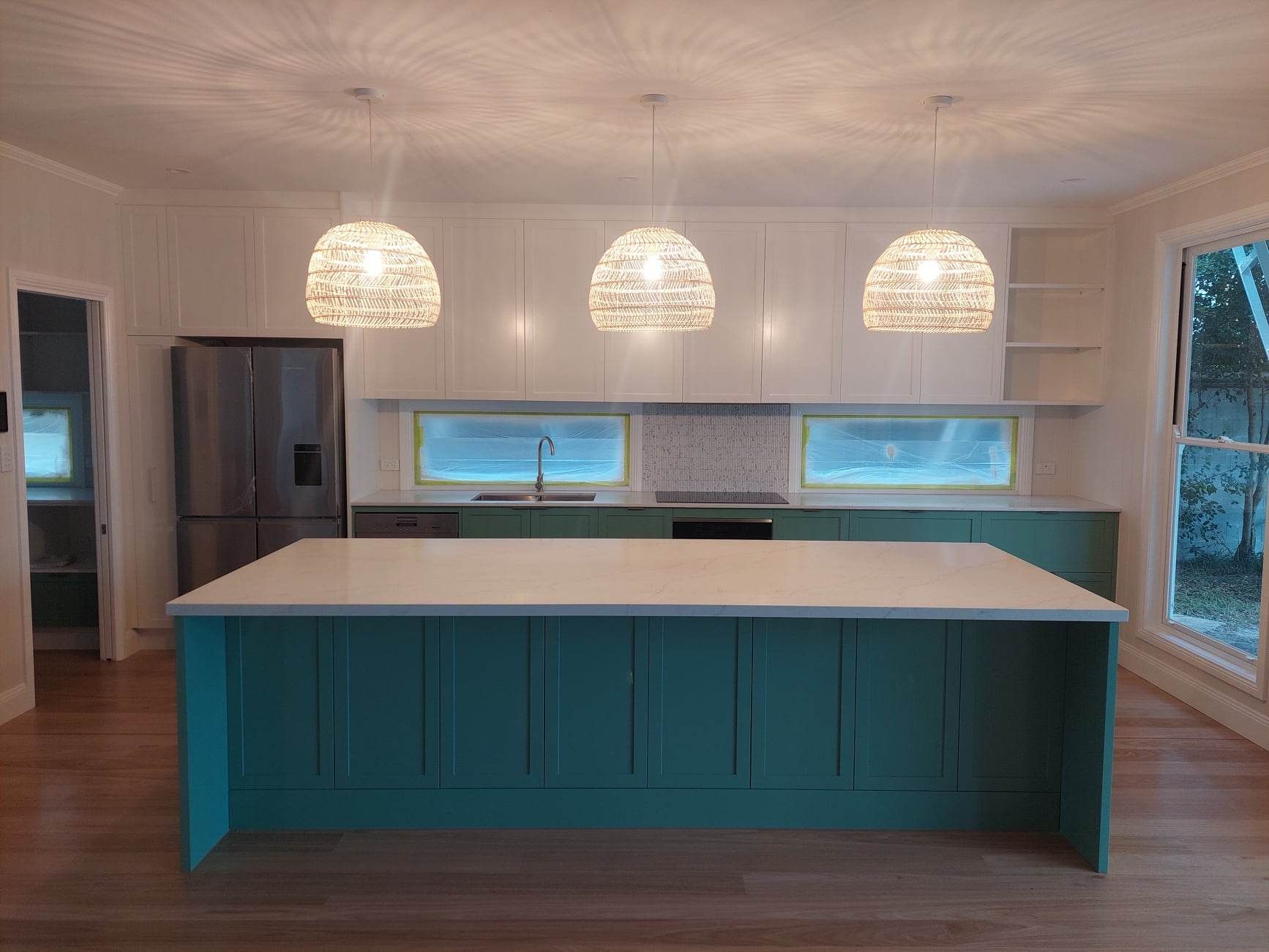 There is a large island in the middle of the kitchen.