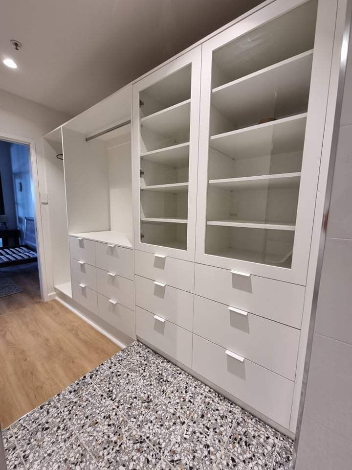A Large Walk in Closet with Lots of Shelves and Drawers — Tailored Interiors in Wacol, QLD