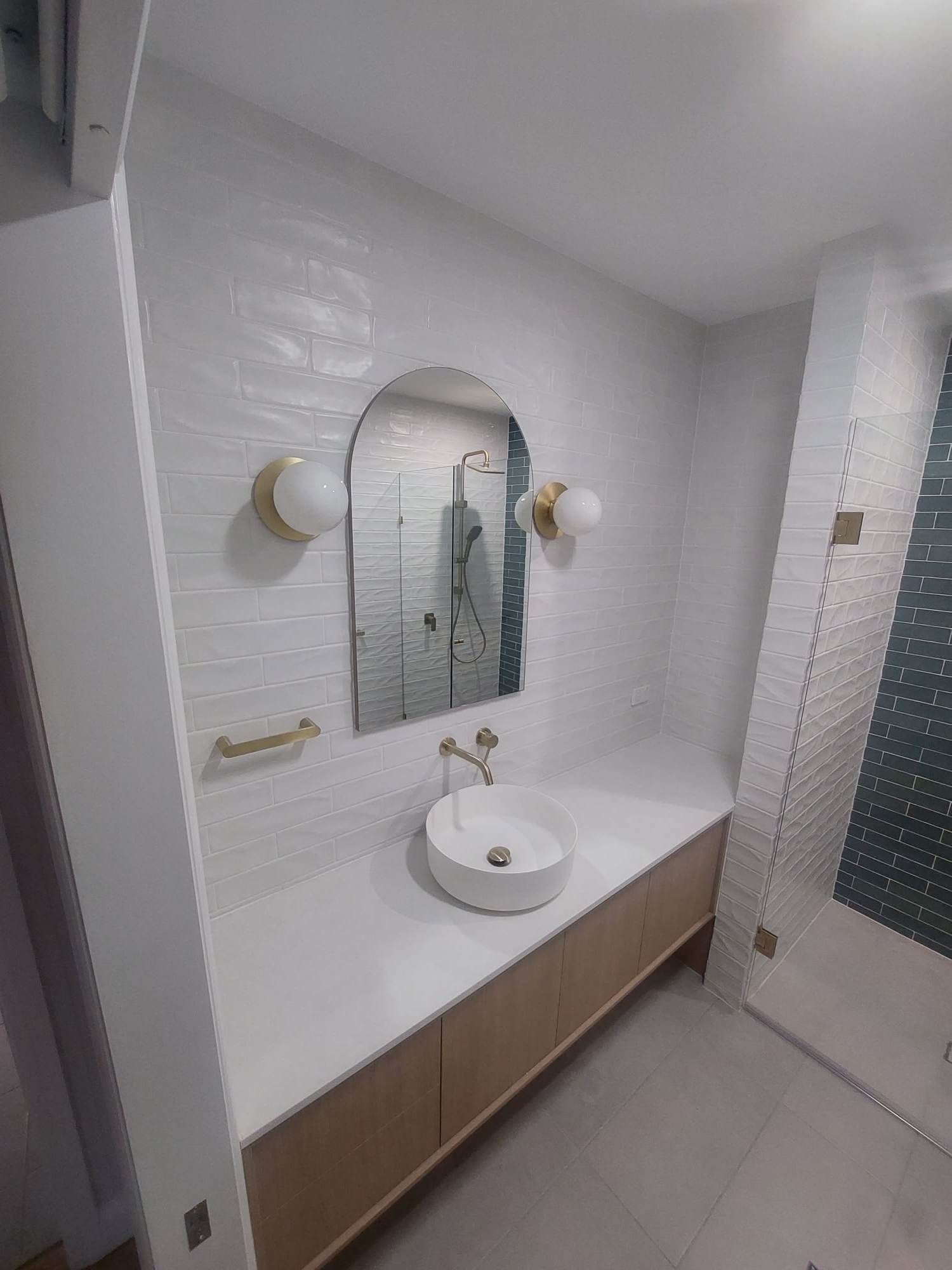 A Bathroom with A Sink , Mirror and Shower — Tailored Interiors in Wacol, QLD