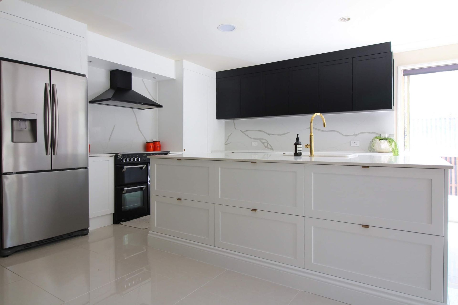 A Kitchen with A Bowl of Fruit on The Counter — Tailored Interiors in Cleveland, QLD