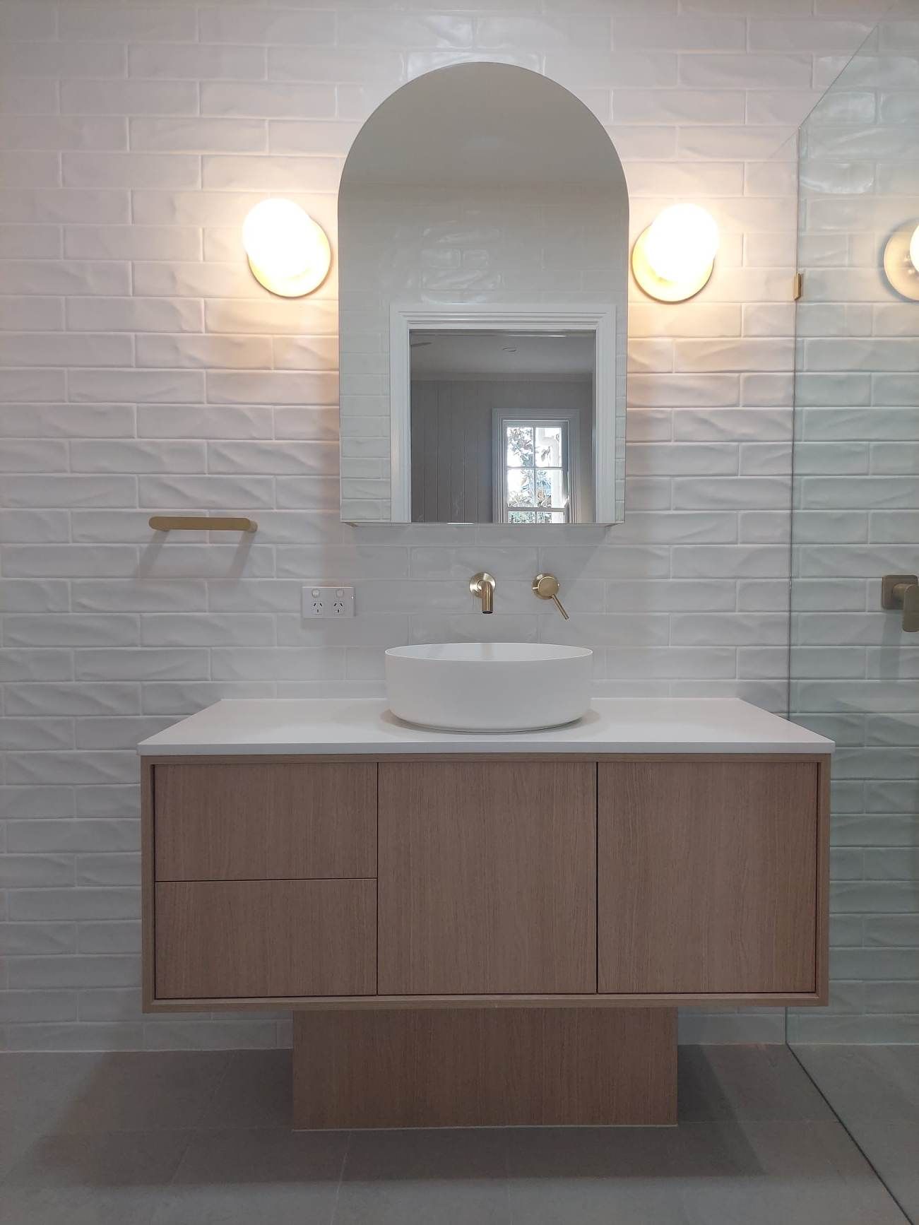 Bathroom Basin With Arch Mirror And Lights — Tailored Interiors in Wacol, QLD