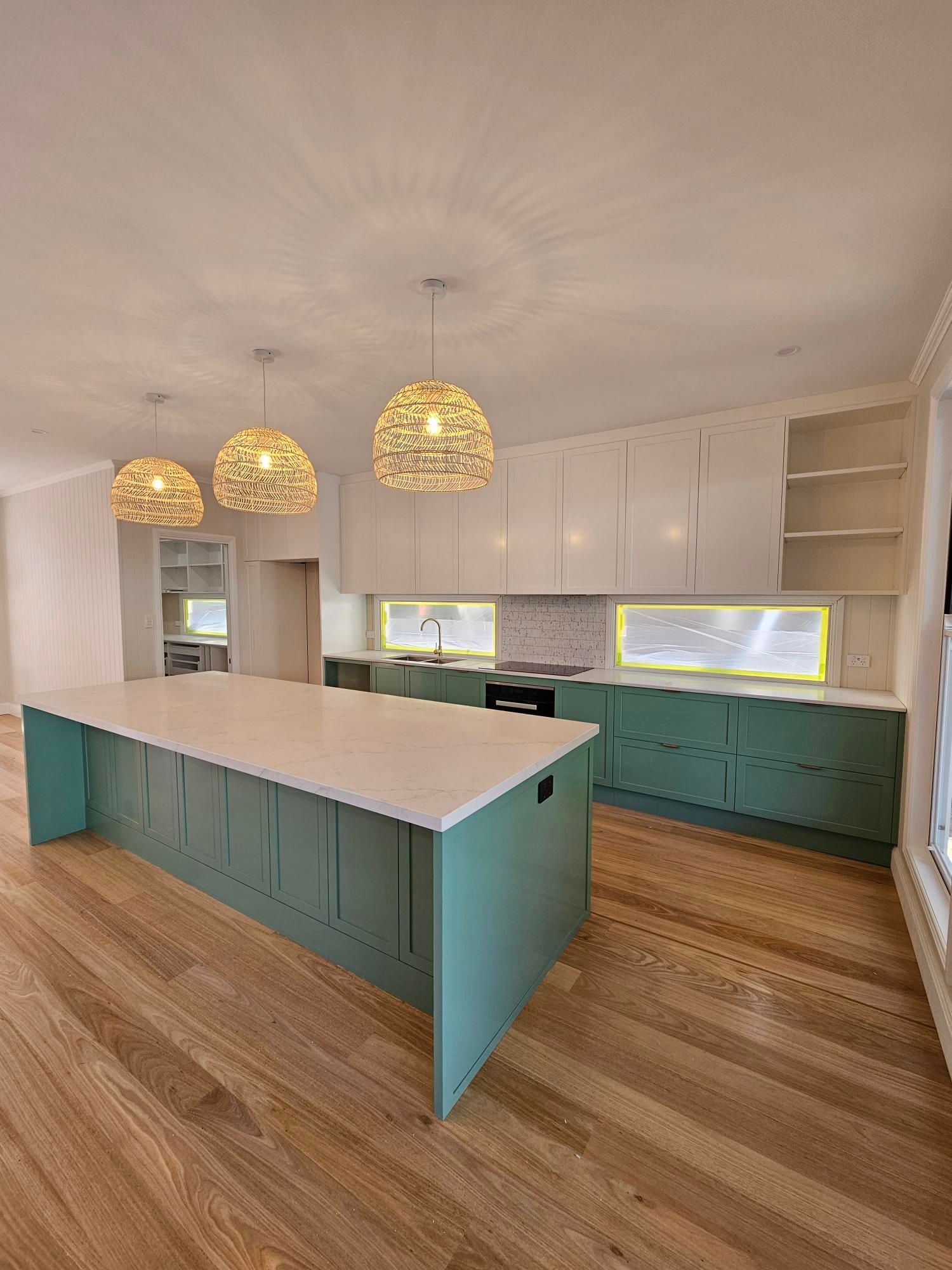 There is a large island in the middle of the kitchen.