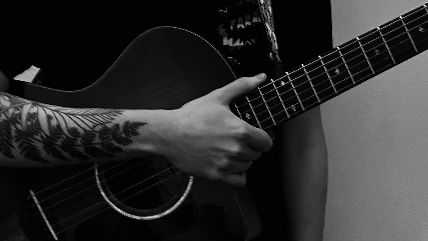 Powerhouse singer-songwriter Joe McNair in La Dragon, Kilmarnock playing his guitar 