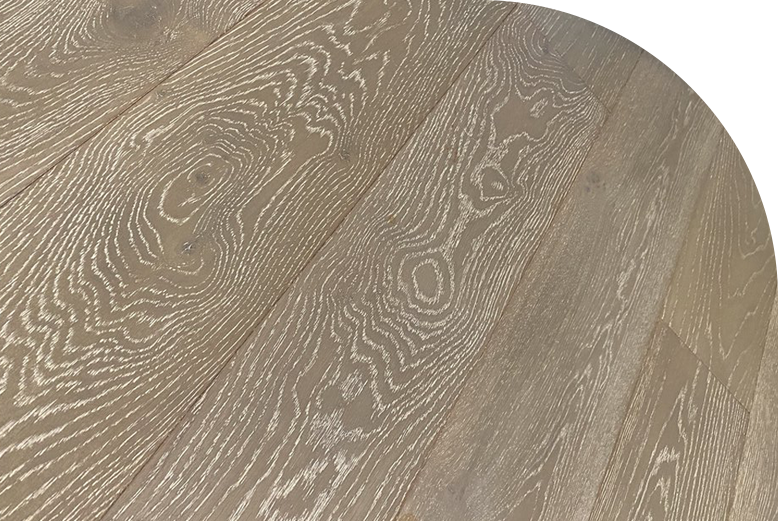 A close up of embossed laminate flooring with a wood-like texture