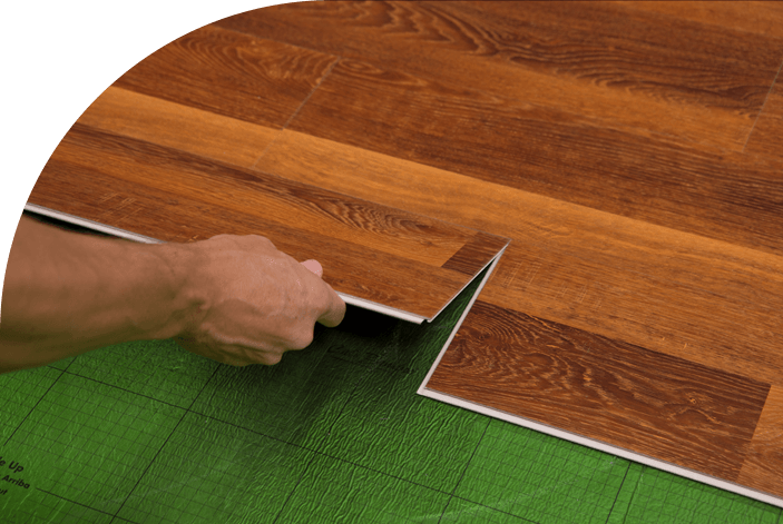 A flooring expert easily installing premium vinyl floor panels