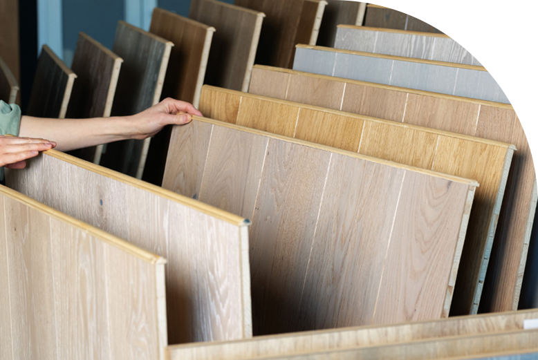 A homeowner browsing through sample flooring materials in a mobile showroom